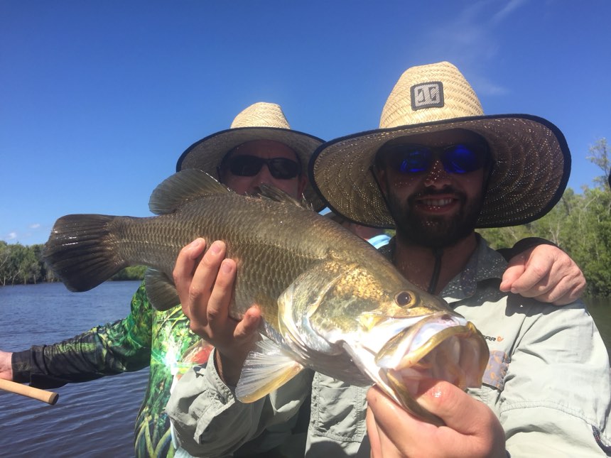 Two mates on the water with a barra