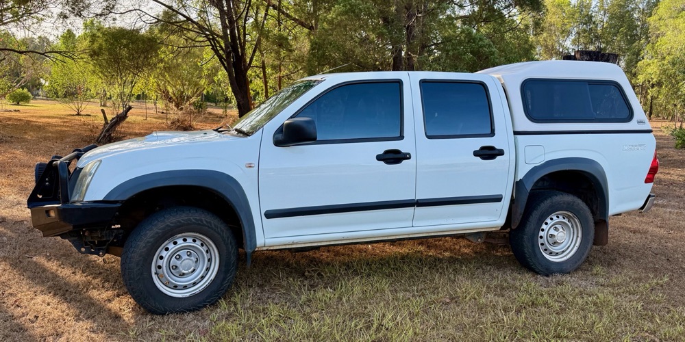 The Barefoot courtesy ute — a white dual-cab Isuzu D-Max four-wheel drive with a lockable canopy and bull bar