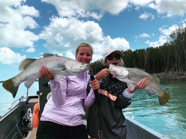 The girls showing the lads how it&rsquo;s done on the flats — a pair of nice barramundi from clean shallow water