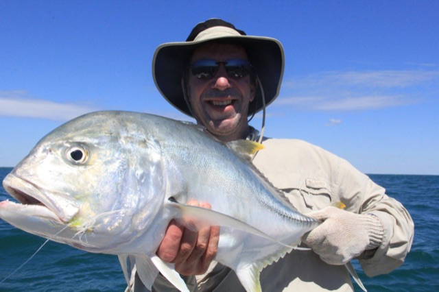Giant trevally held up on the bluewater