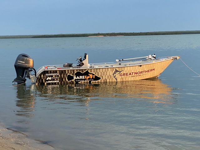 The Barefoot boat sitting on the flats at low tide