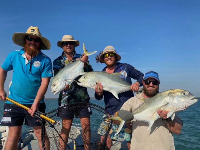Triple hook-up — three anglers with good giant trevally at Bynoe Harbour
