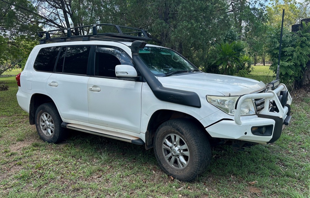 The Barefoot Land Cruiser 200 with bull bar and roof rack parked under Top End trees